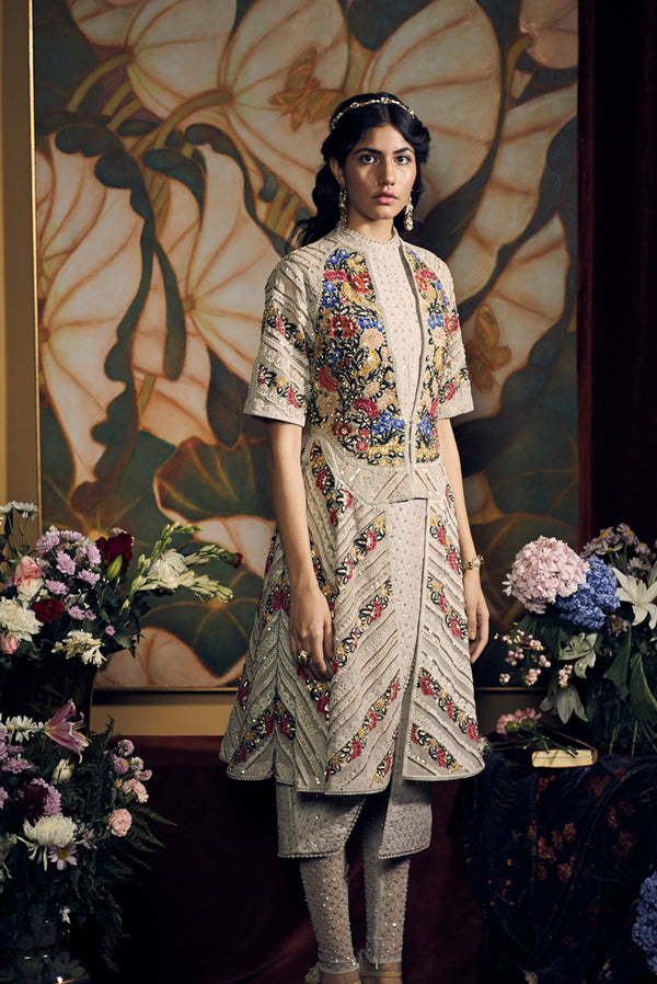 a woman standing on a bed in a room 