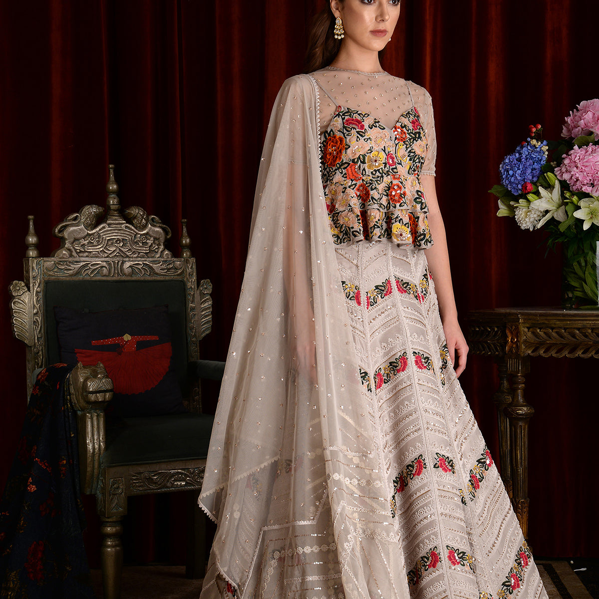 Photo of Whit and Pink lehengas with cape style dupatta. Suits well for  gromm's or bride's sister.